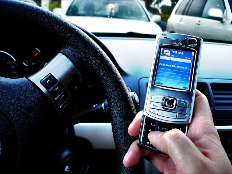 Texting while driving - via Flickr
