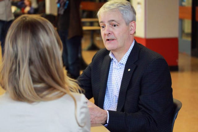 Marc Garneau, the first Canadian ever to go to space, chats with students in the Education Building during a recent visit to campus. 