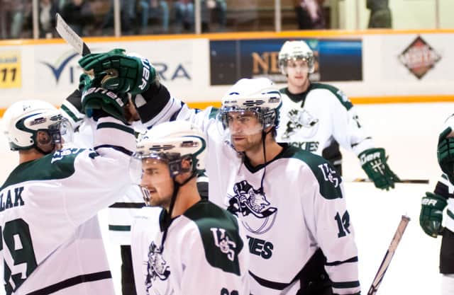 The Huskies men's hockey team celebrated after scoring seven goals in their 2013 playoff debut against the Manitoba Bisons.