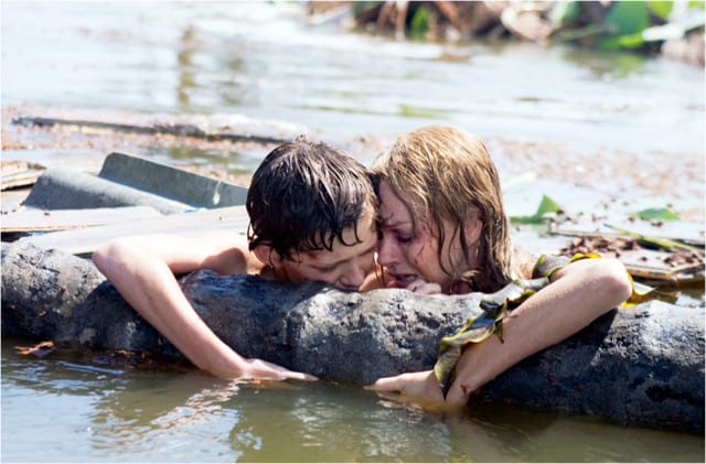 Maria Belon (Naomi Watts) clings to her son Lucas (Tom Holland) in a moment of desperation in The Impossible.