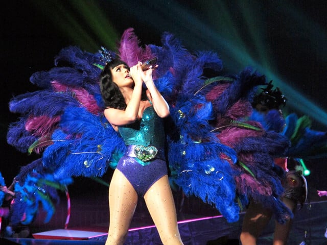 Katy Perry knows that nothing says diva like strutting your stuff in a giant peacock outfit. 