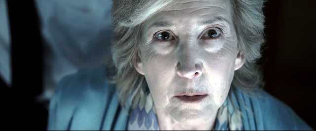 Elise (Lin Shaye) may have died in the first film, but that doesn’t stop her from helping with the investigations this time around. 