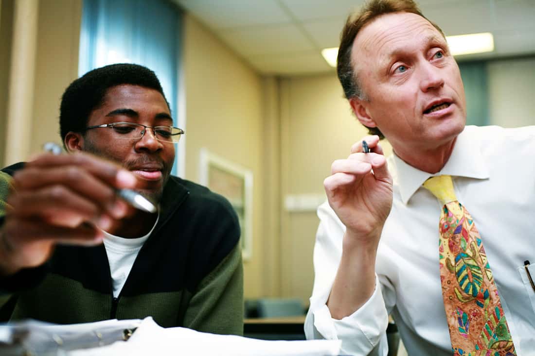 Bruce Reed, right, teaches a student in the School of Public Health.