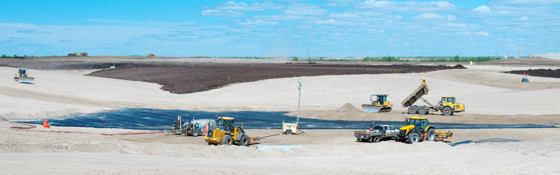 Tailings sands north of Fort McMurray, Alta. required 65,000 truckloads of dirt to be covered.