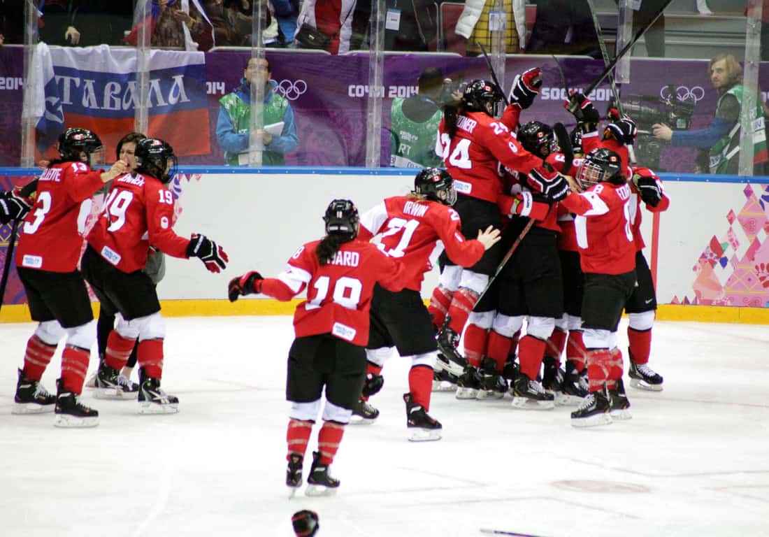 Team Canada celebrates after coming back from 0-2 down to defeat the Americans and win a fourth consecutive gold medal. 