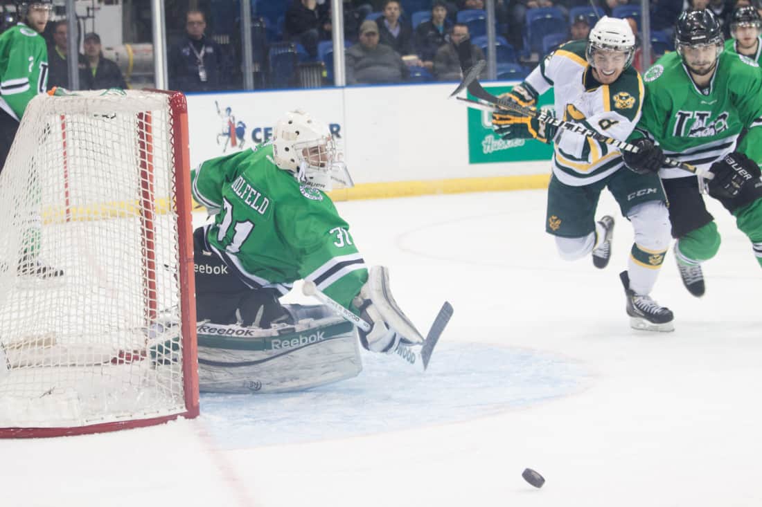 Huskie goalie Ryan Holfeld made 33 saves, including the one pictured, in the CIS mens hockey final versus the Alberta Golden Bears.