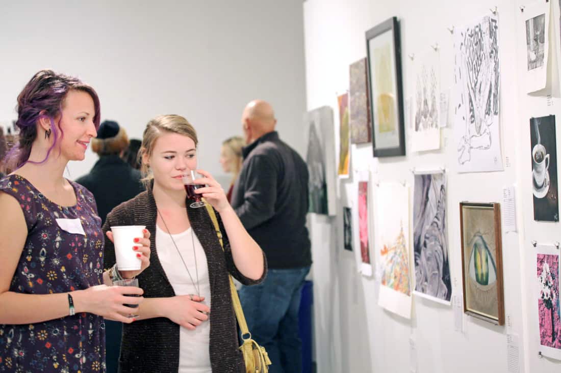 Attendees enjoying the art displayed at the Gordon Snelgrove Gallery’s annual event Silence!.