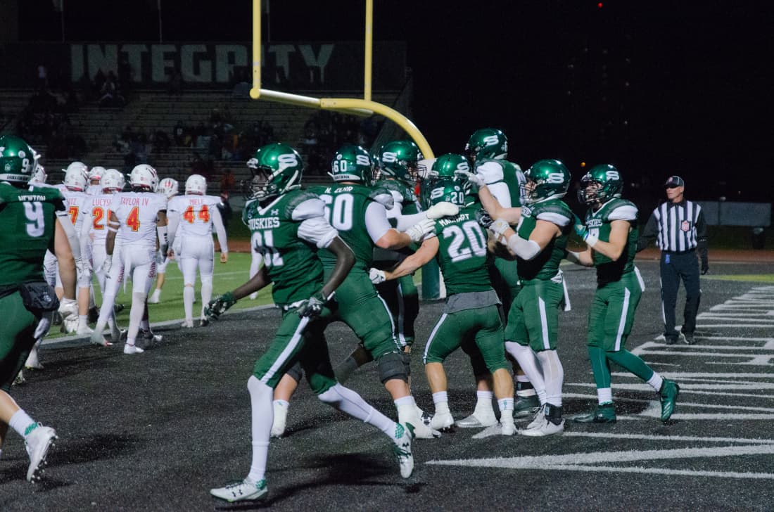 U of S football players celebrating a touchdown on Sept. 27, 2019.