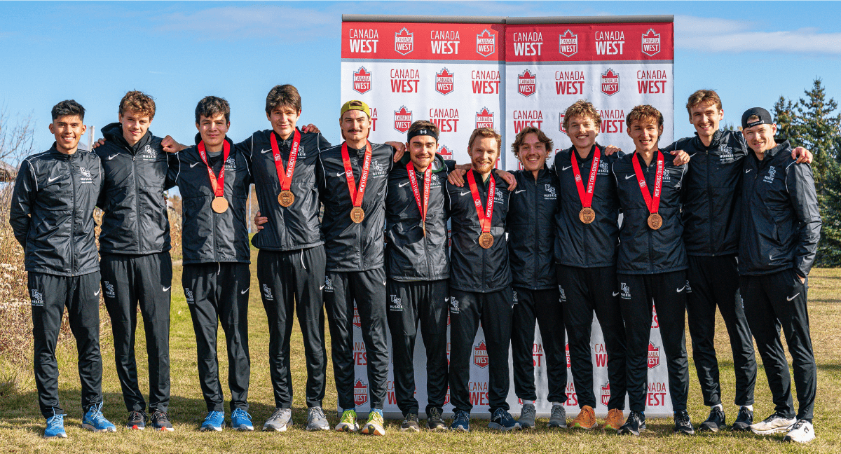 The Huskie mens cross country team after capturing Canada West Bronze in Camrose, Alberta | Adrien Bazinet Alberta Athletics