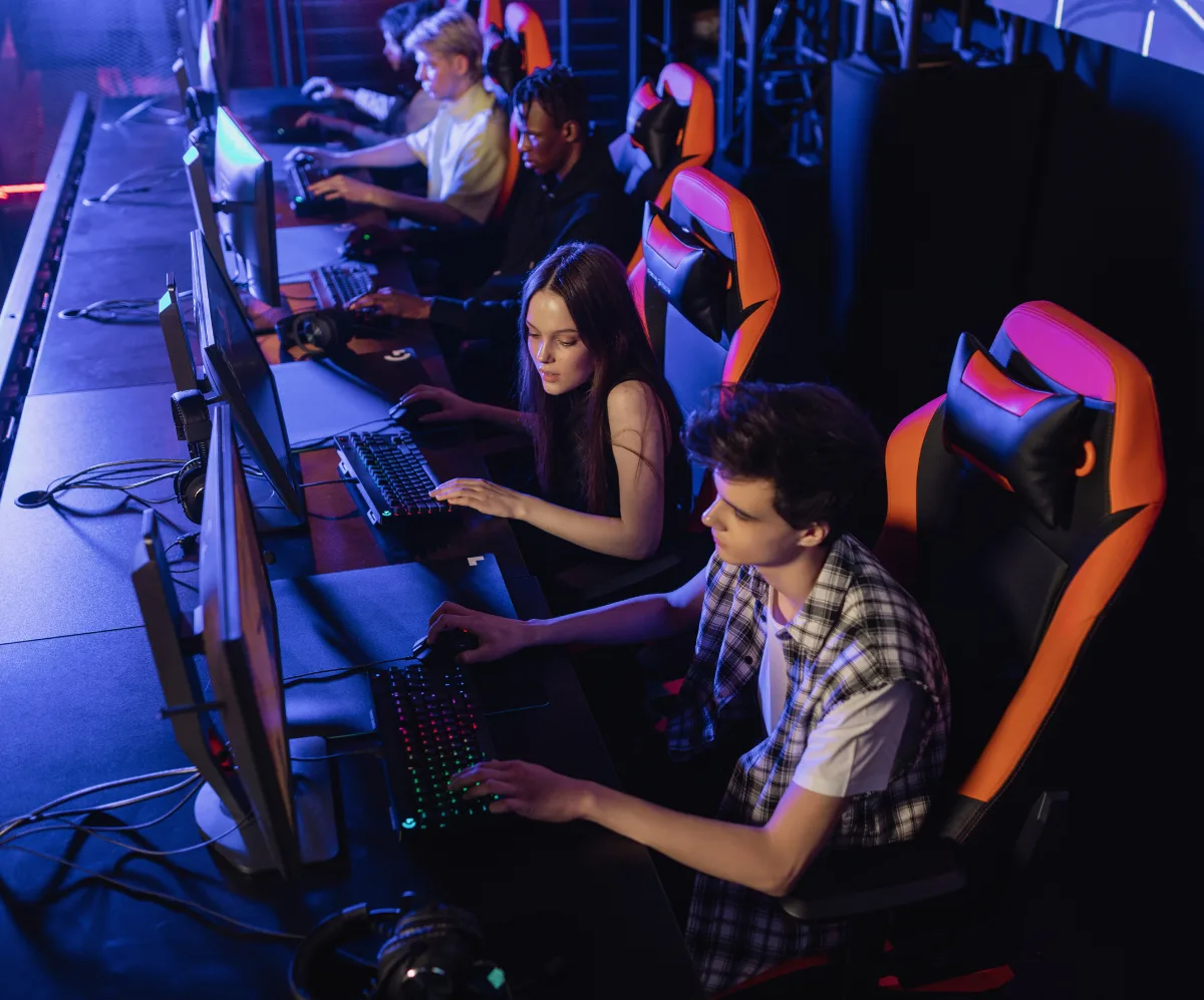 People sitting on a gaming chair while playing video games | Alena Darmel from Pexels | Canva Pro