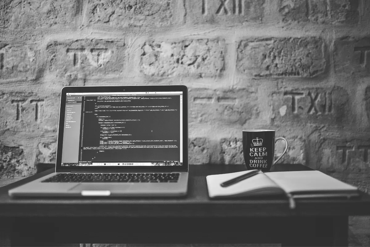 Laptop near notebook and ceramic mug on table | Negative Space from Pexels | Canva Pro