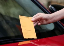 Parking violation ticket on car windshield | Pixelshot | Canva Pro
