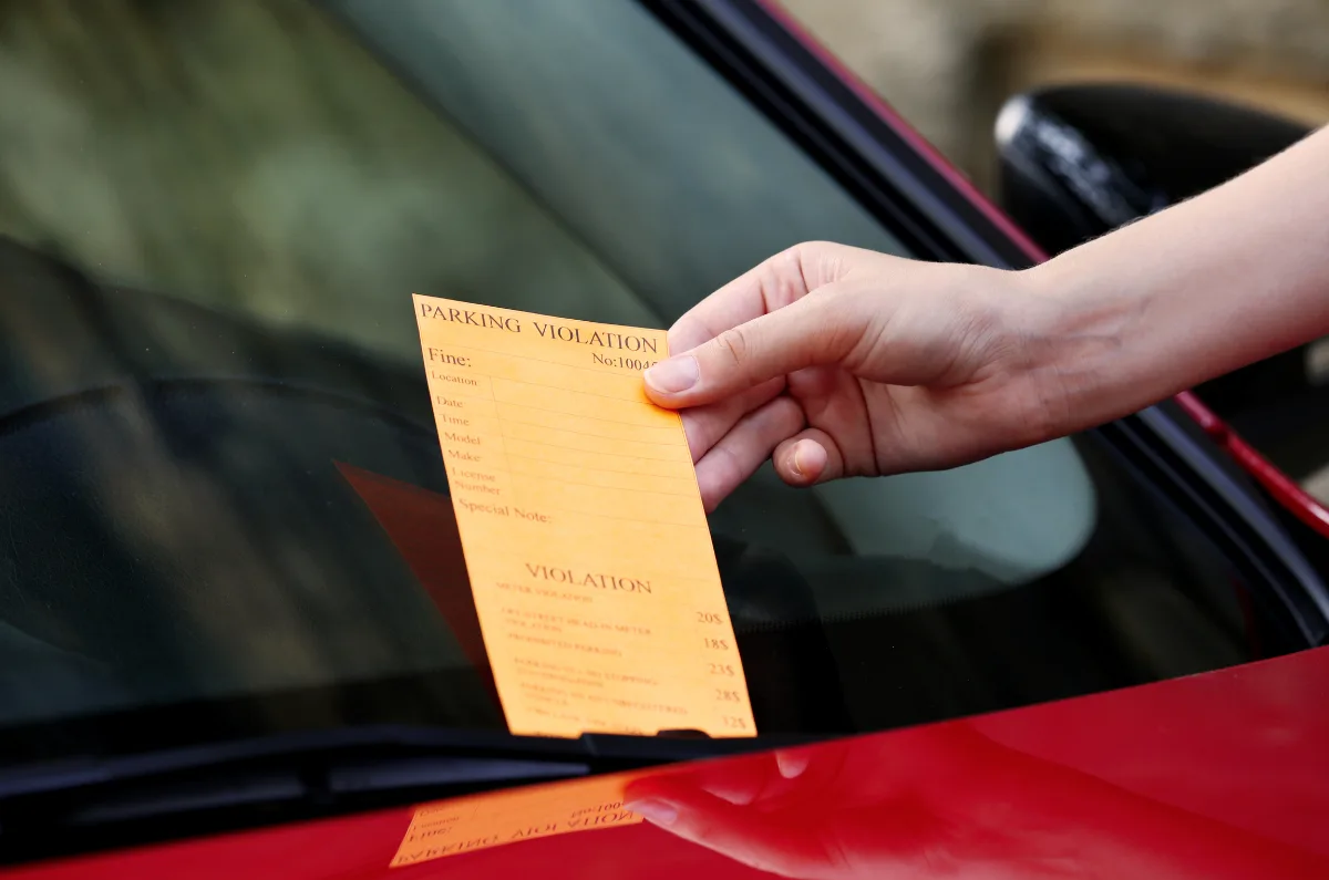 Parking violation ticket on car windshield | Pixelshot | Canva Pro