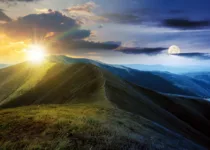 Mountain ridge during dawn with moon and sun | Mike Pellinni Photography | Canva Pro