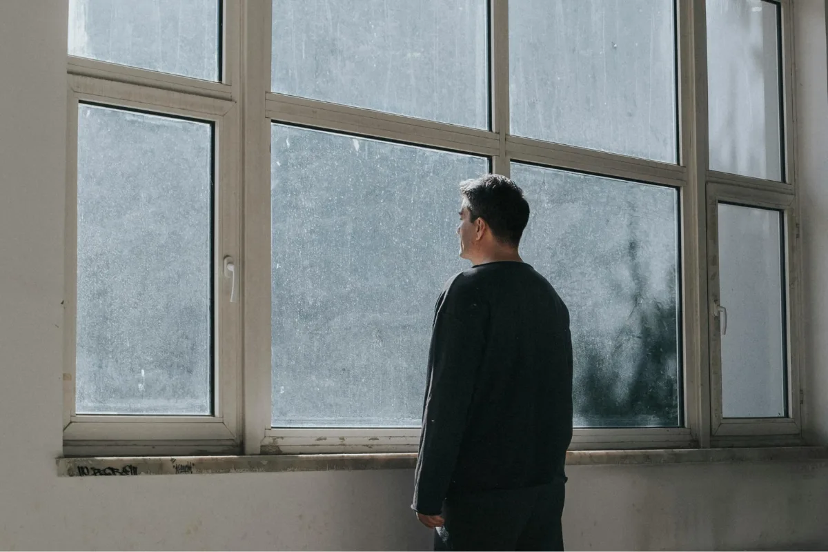 Man looks through windows | Feyza Yildirim from Pexels | Canva Pro
