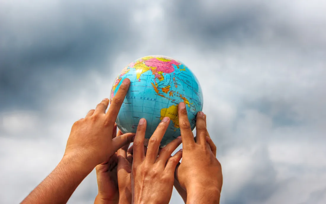Hand holding globe | Sydeen from Getty Images | Canva Pro