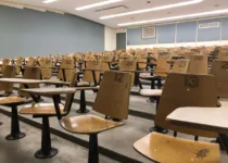 Numbered desks in an empty USask classroom | Colton Danneberg