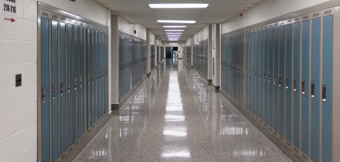 Highschool hallway lined with lockers | David Wood from Woody’s Photos | Canva Pro