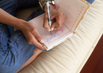 Woman's hands writing in a journal | Jupiterimages, Photo Images | Canva Pro