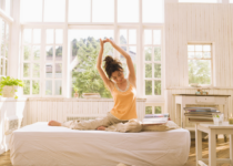 Morning stretch in a sunlit room| Aflo Images| Canva Pro