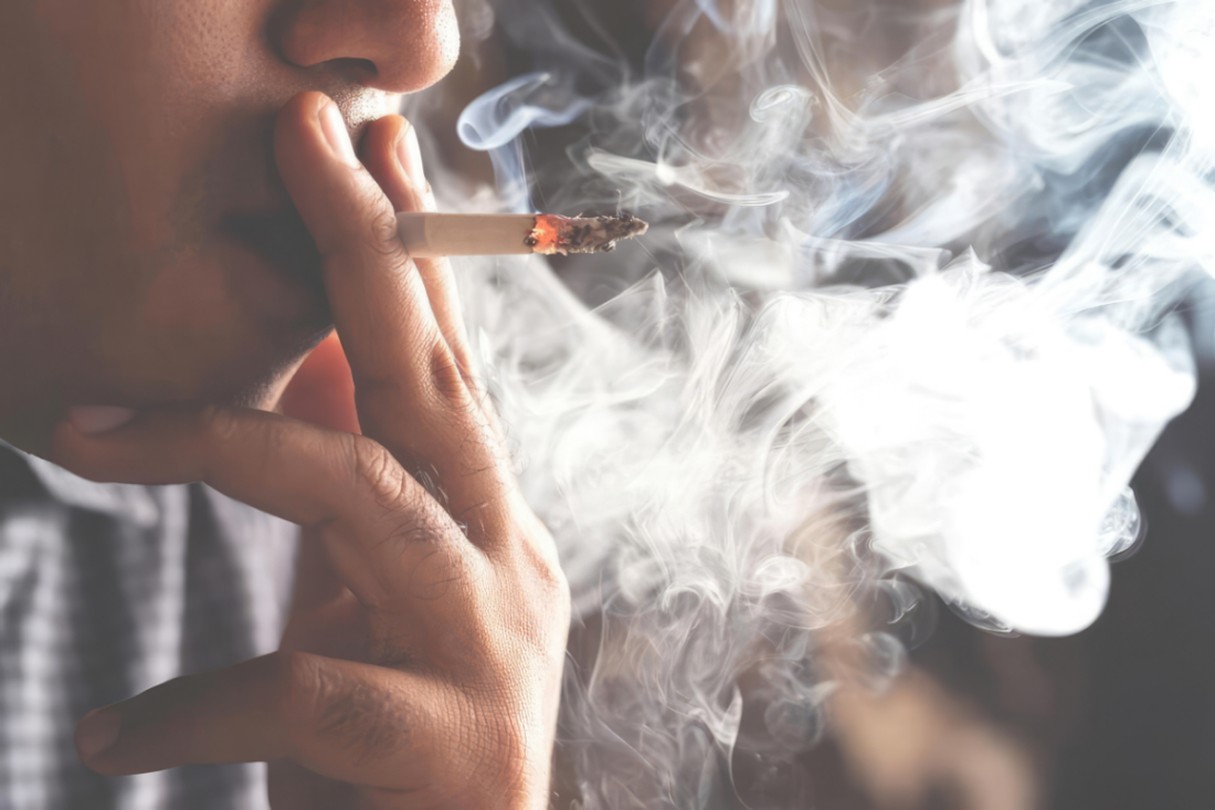 Person smoking a cigarette | Dragos Negoita’s Images | Canva Pro