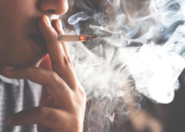 Person smoking a cigarette | Dragos Negoita’s Images | Canva Pro